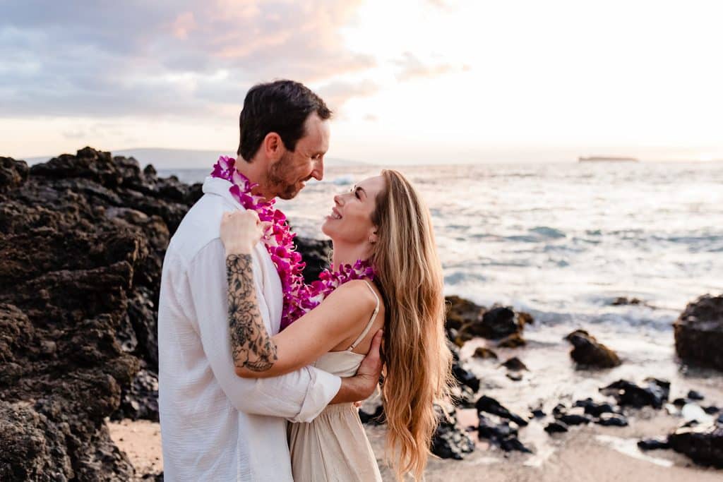 Patrick and Rachel hugging and looking into each others eyes while smiling.