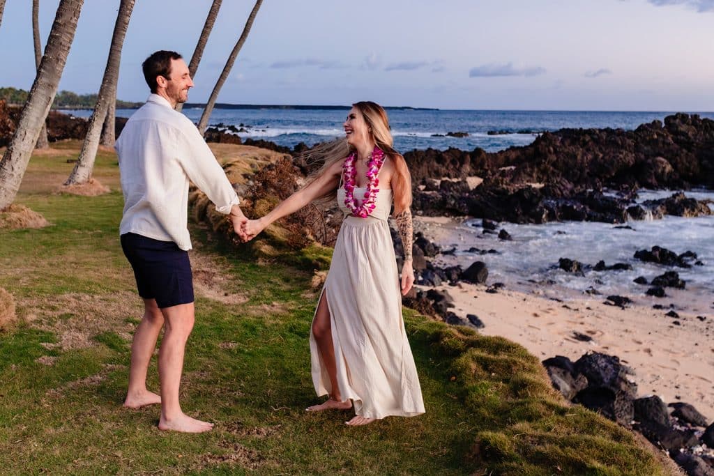 Patrick and Rachel holding hands after he spins her around and they laugh at each other.