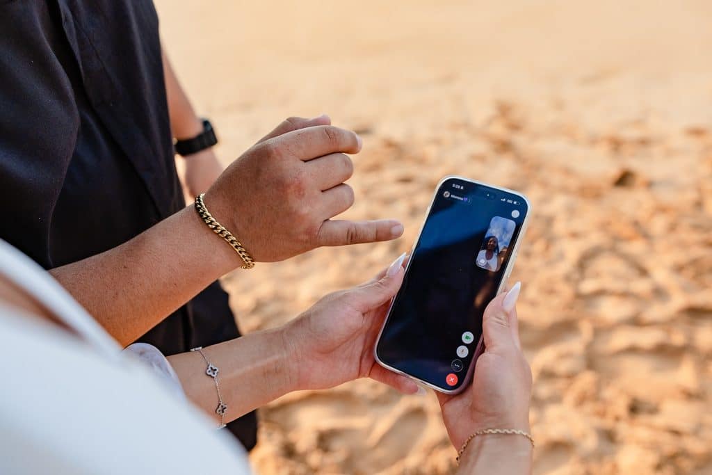 A photo of Alexis on Facetime with her Mom to show her the engagement ring