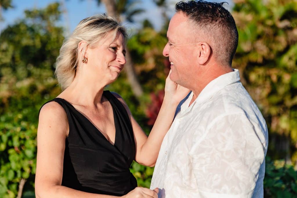 Andy is smiling at Joy while Joy puts her hand on his cheek and smiles at him with tears in her eyes.